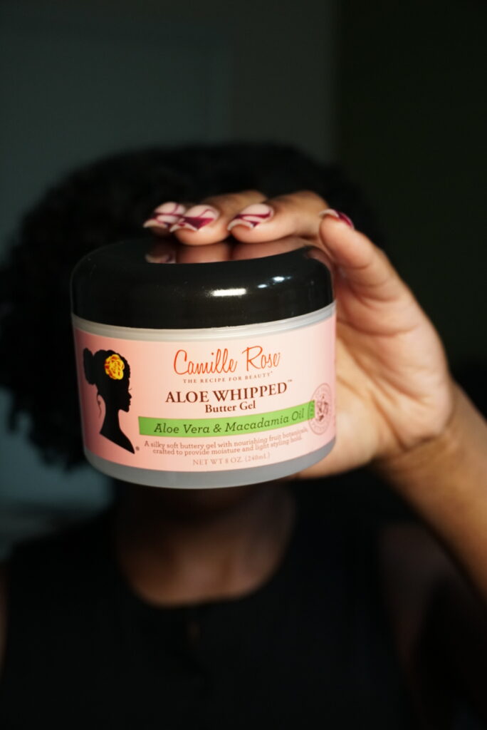 Camille Rose Aloe Whipped Butter Gel held for natural hair.
